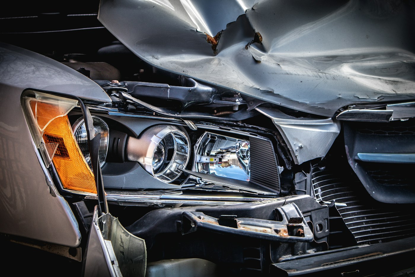 Damaged car with a crushed hood after an accident